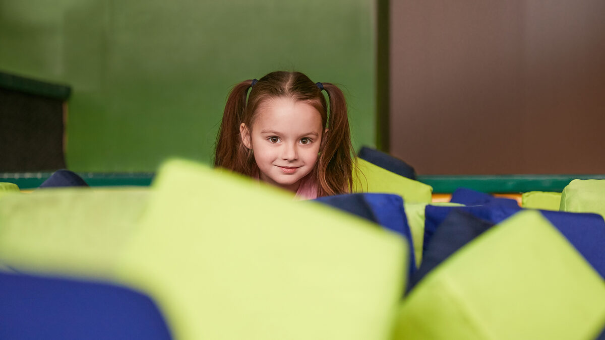 Child smiling comfortably at home